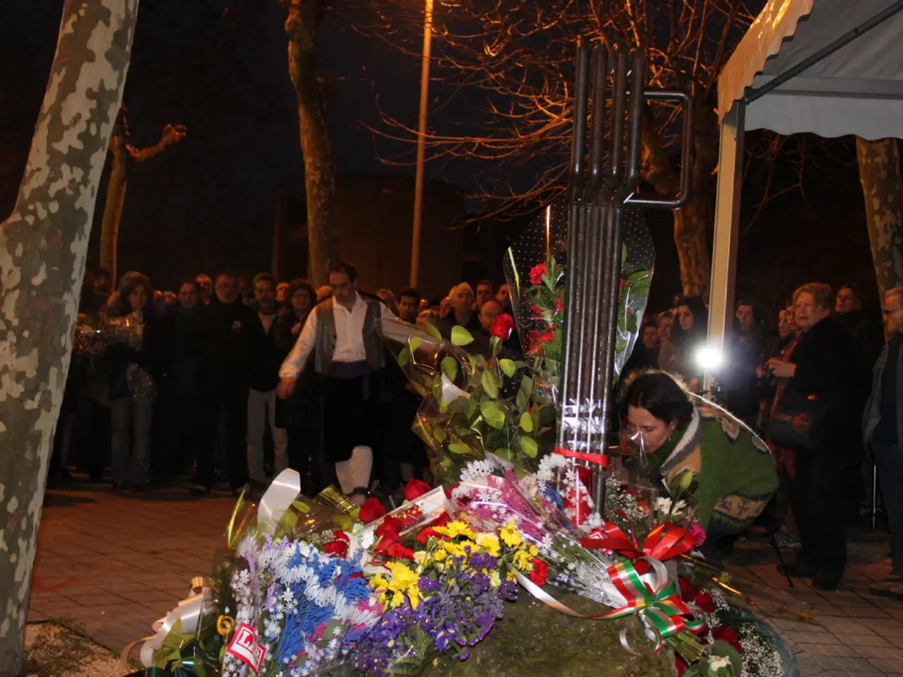 Autumnal gathering of seniors within a bell tent on a sloping hillside