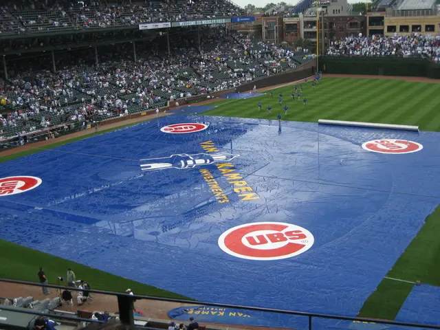 This image looks like a stadium, in this image we can see a few people, among them some people are...