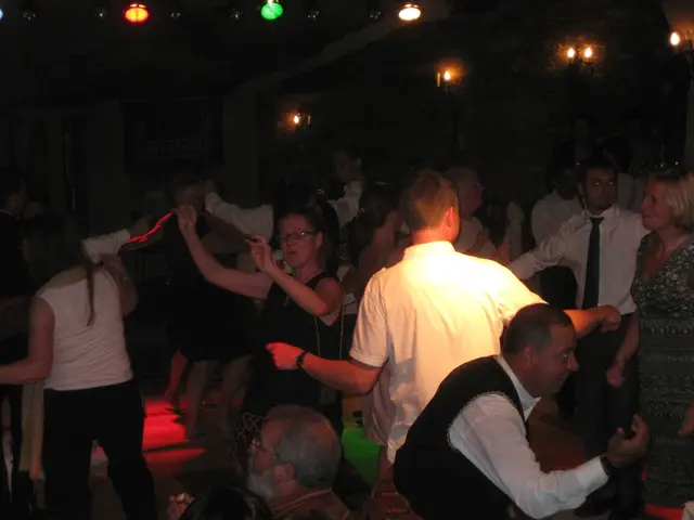 It is a party,all the people are enjoying the music and dancing on the floor and to the roof there...
