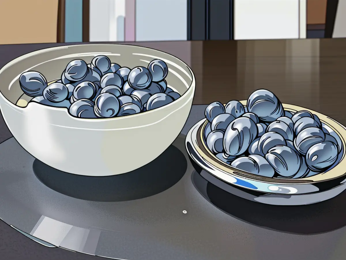 Stainless steel bowls of different sizes by Yeti, arranged neatly with a clear lid, positioned on a dark tabletop. Revamped Yeti Rambler Bowls Ideal for Buffet Gatherings
